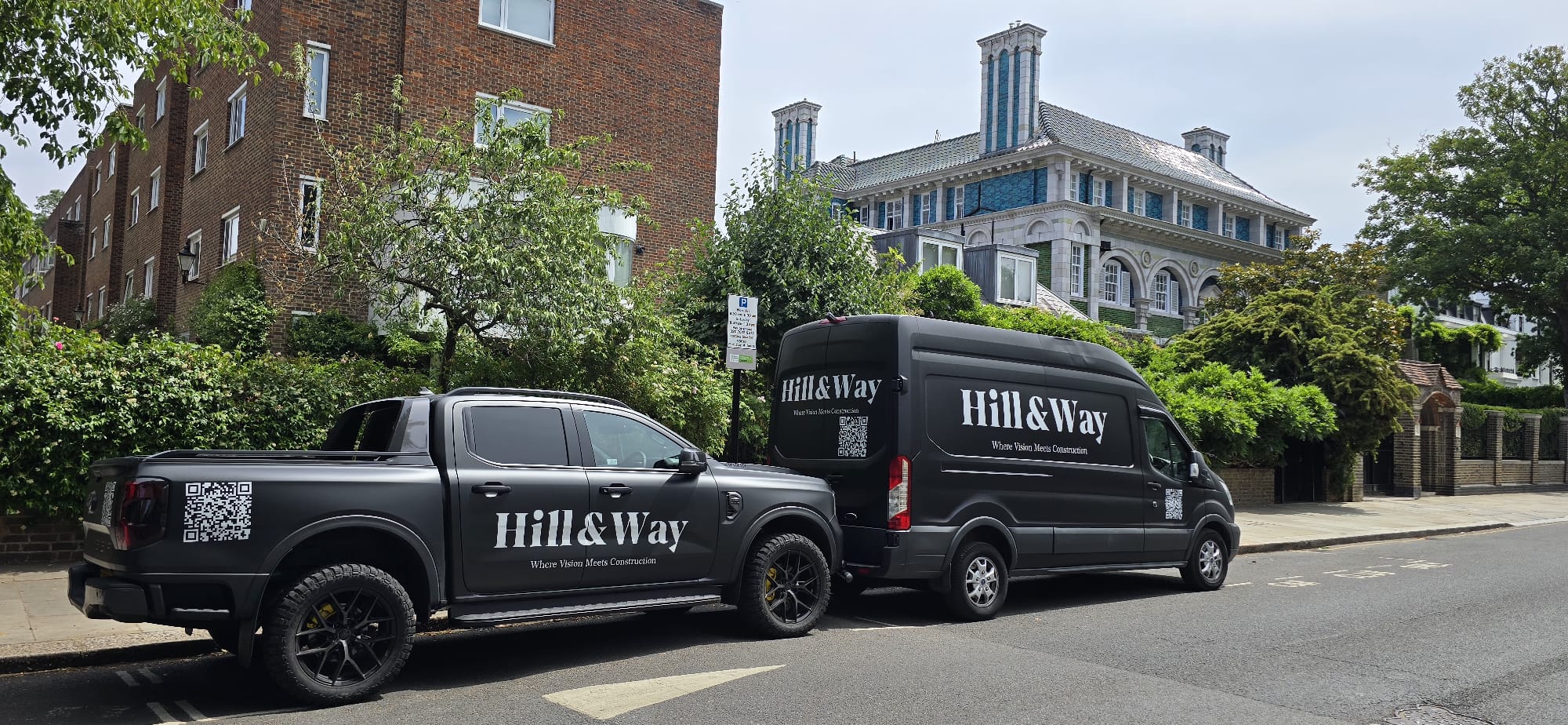 Hill & Way branded vans in a Notting Hill mews